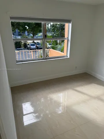 a bathroom with a shower and toilet