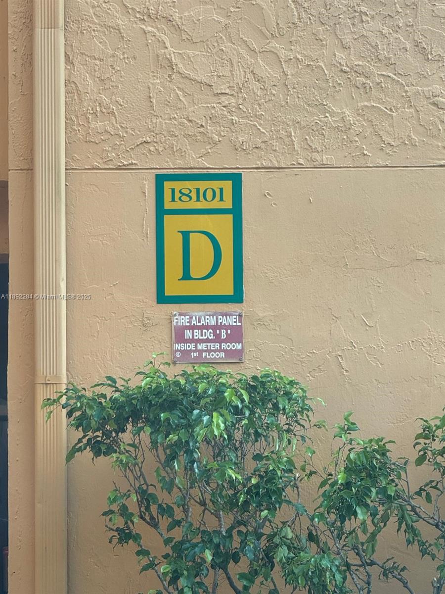 18101 Northwest 68th Avenue, Unit D207 Hialeah, FL 33015 - Photo 3 of 18 a sign that is on a wall