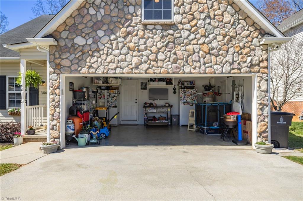 3564 Millie Lane Pfafftown, NC 27040 - Photo 34 of 40 Garage with garage shelving above that will remain