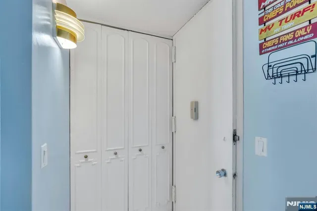 a bathroom with a light fixture and a window