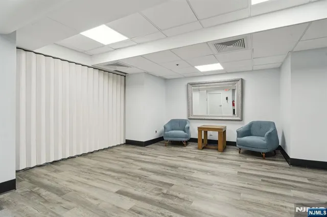 a room with furniture and a wooden floor