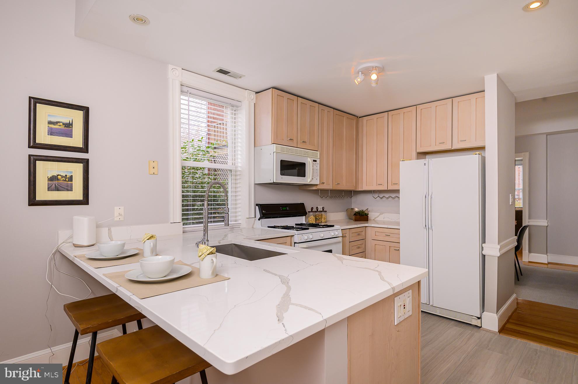709 3rd Street Northeast Washington, DC 20002 - Photo 15 of 39 Quartz breakfast counter seating