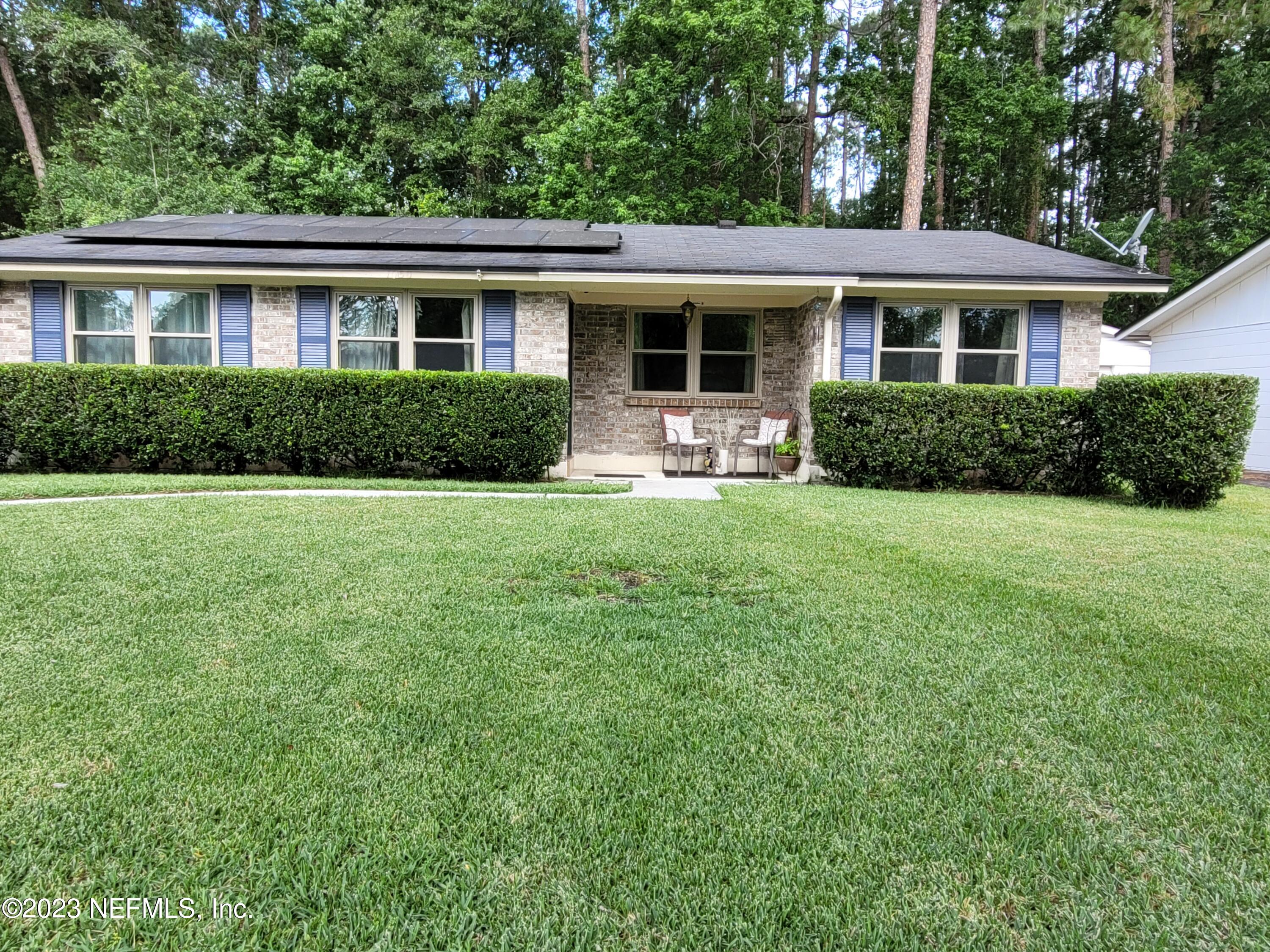 1050 Perkins Place Jacksonville, FL 32221 - Photo 1 of 18 a view of a house with a backyard