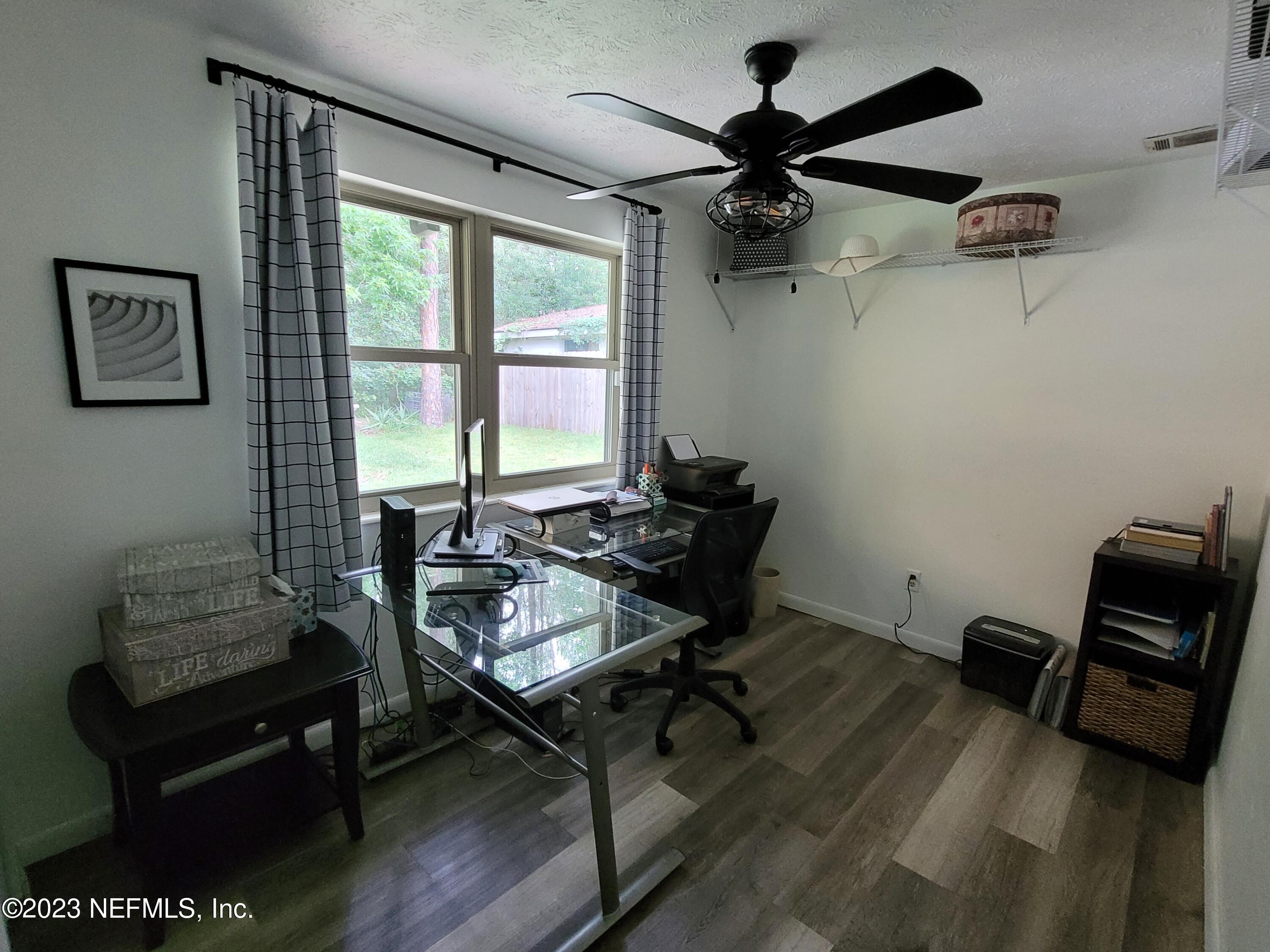 1050 Perkins Place Jacksonville, FL 32221 - Photo 11 of 18 a view of a workspace with furniture and a window