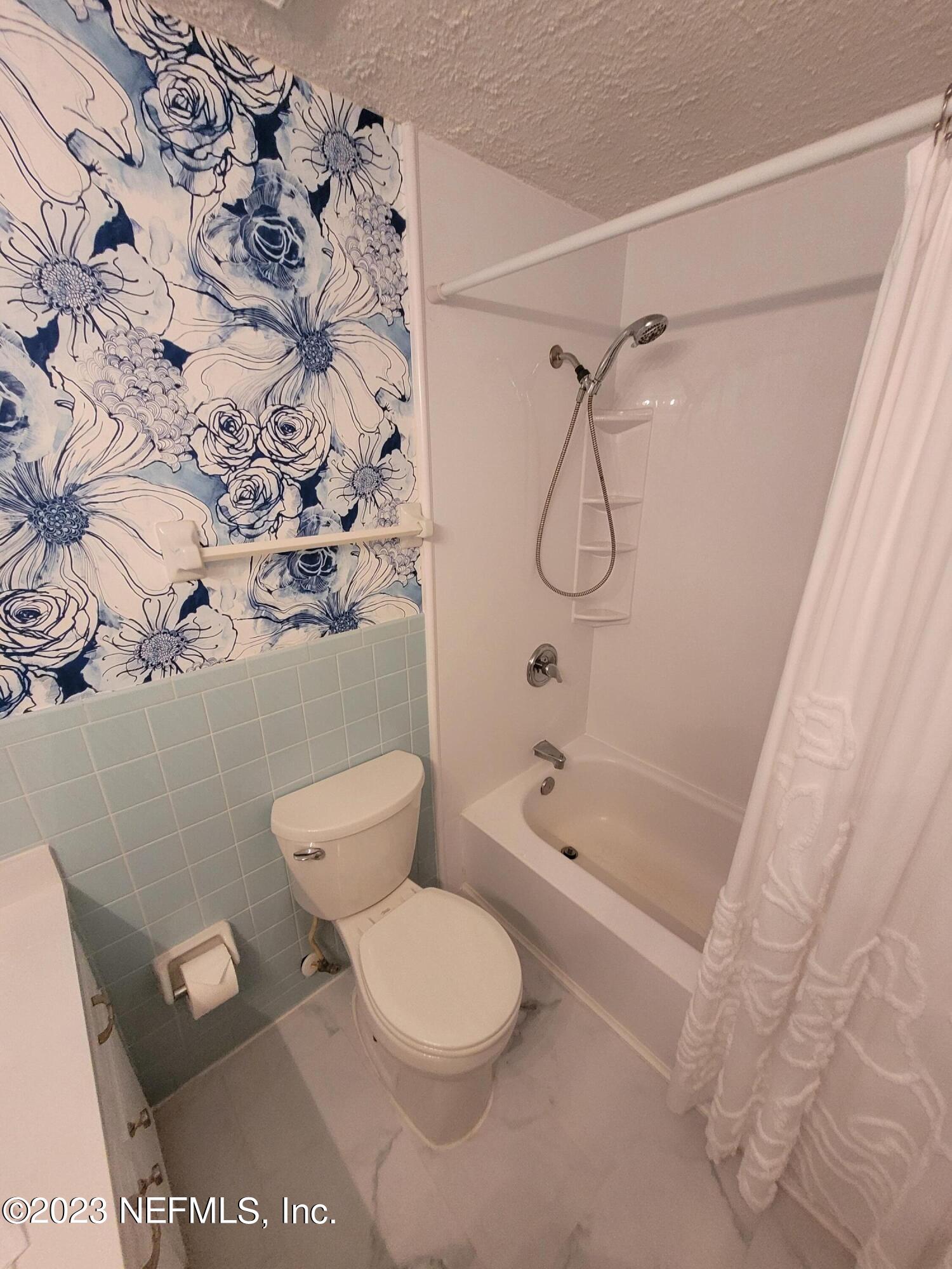 1050 Perkins Place Jacksonville, FL 32221 - Photo 15 of 18 a bathroom with a toilet and a shower