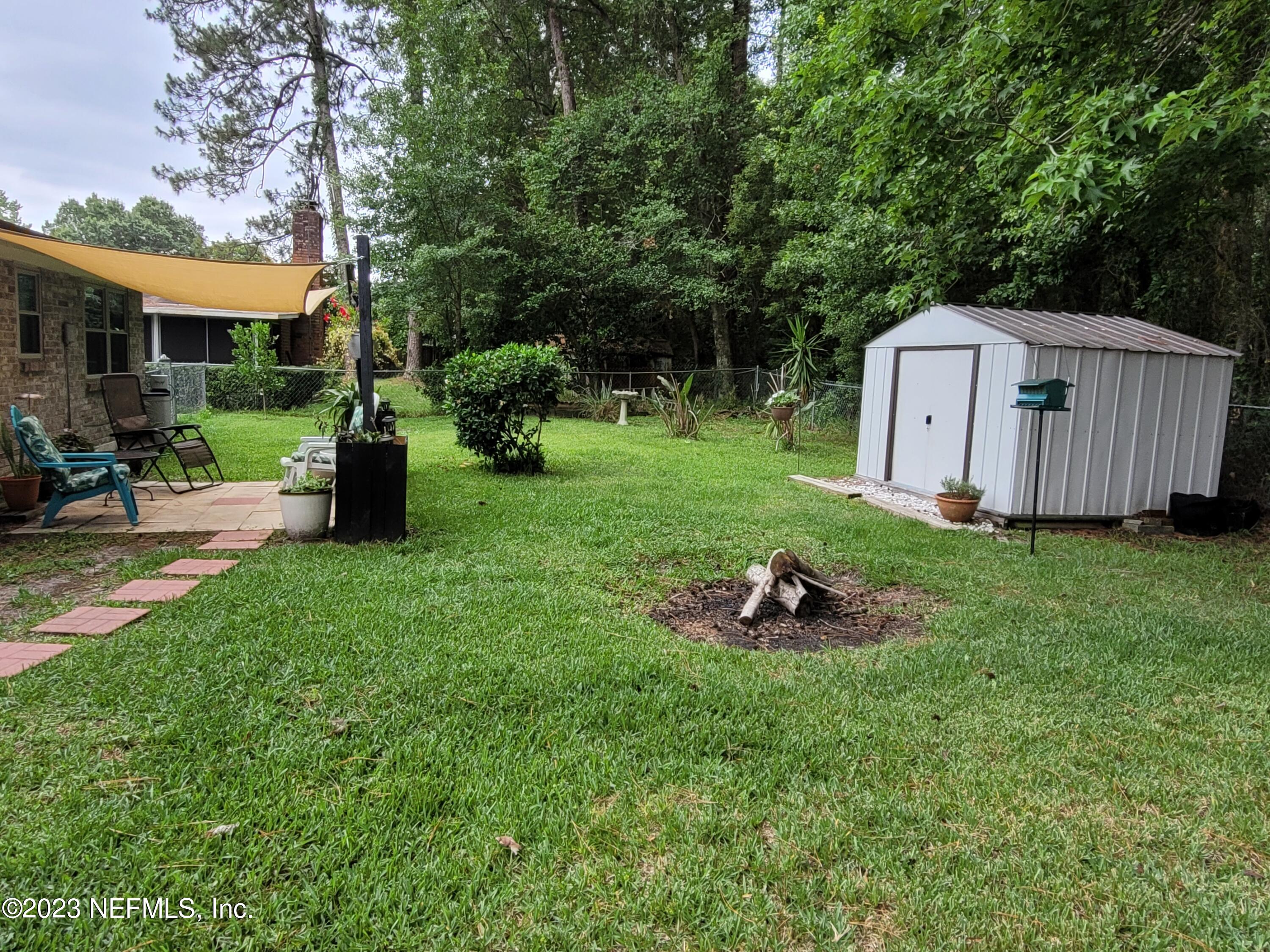 1050 Perkins Place Jacksonville, FL 32221 - Photo 17 of 18 a garden view with a seating space