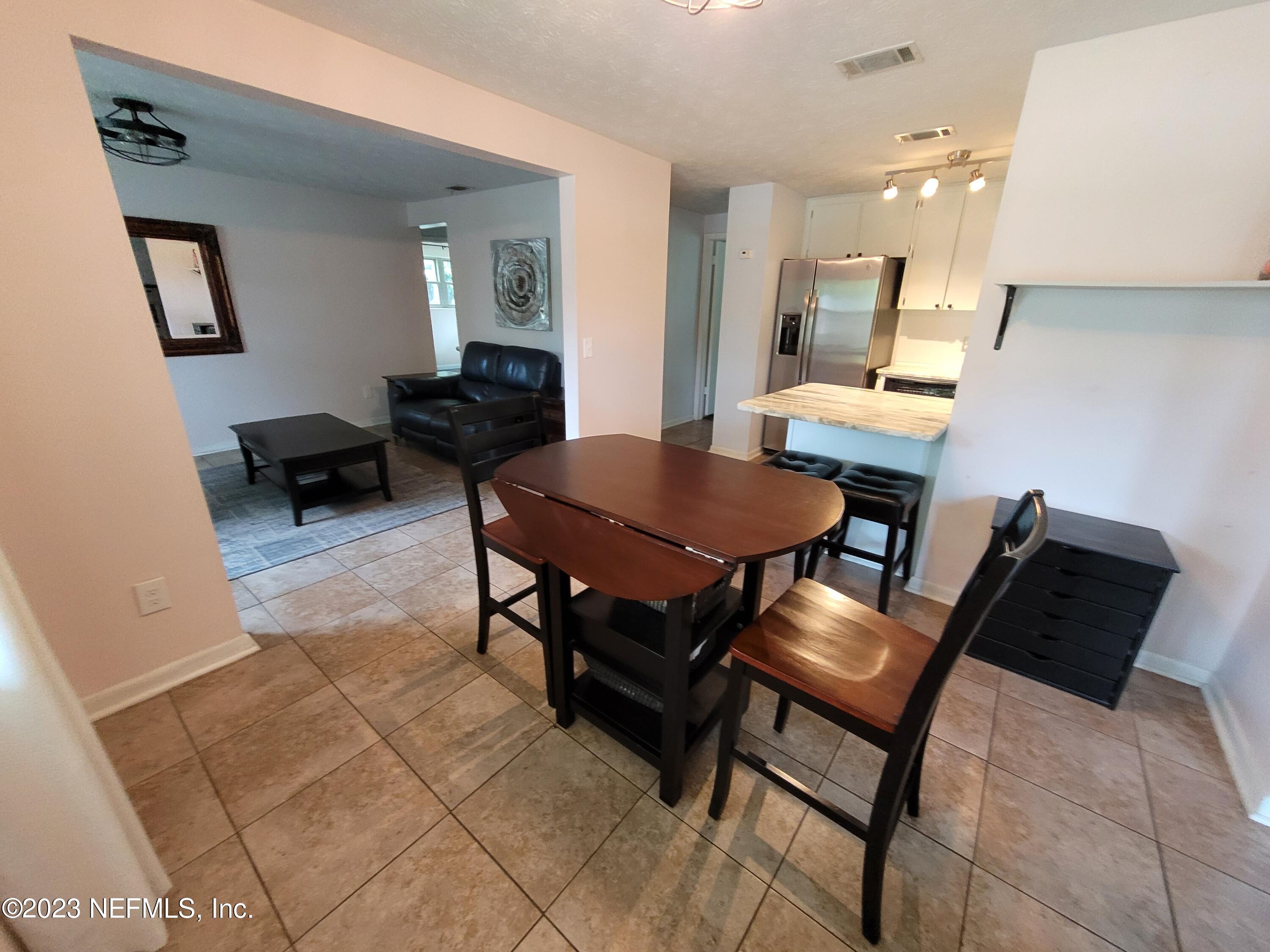 1050 Perkins Place Jacksonville, FL 32221 - Photo 7 of 18 a living room with furniture and a wooden floor