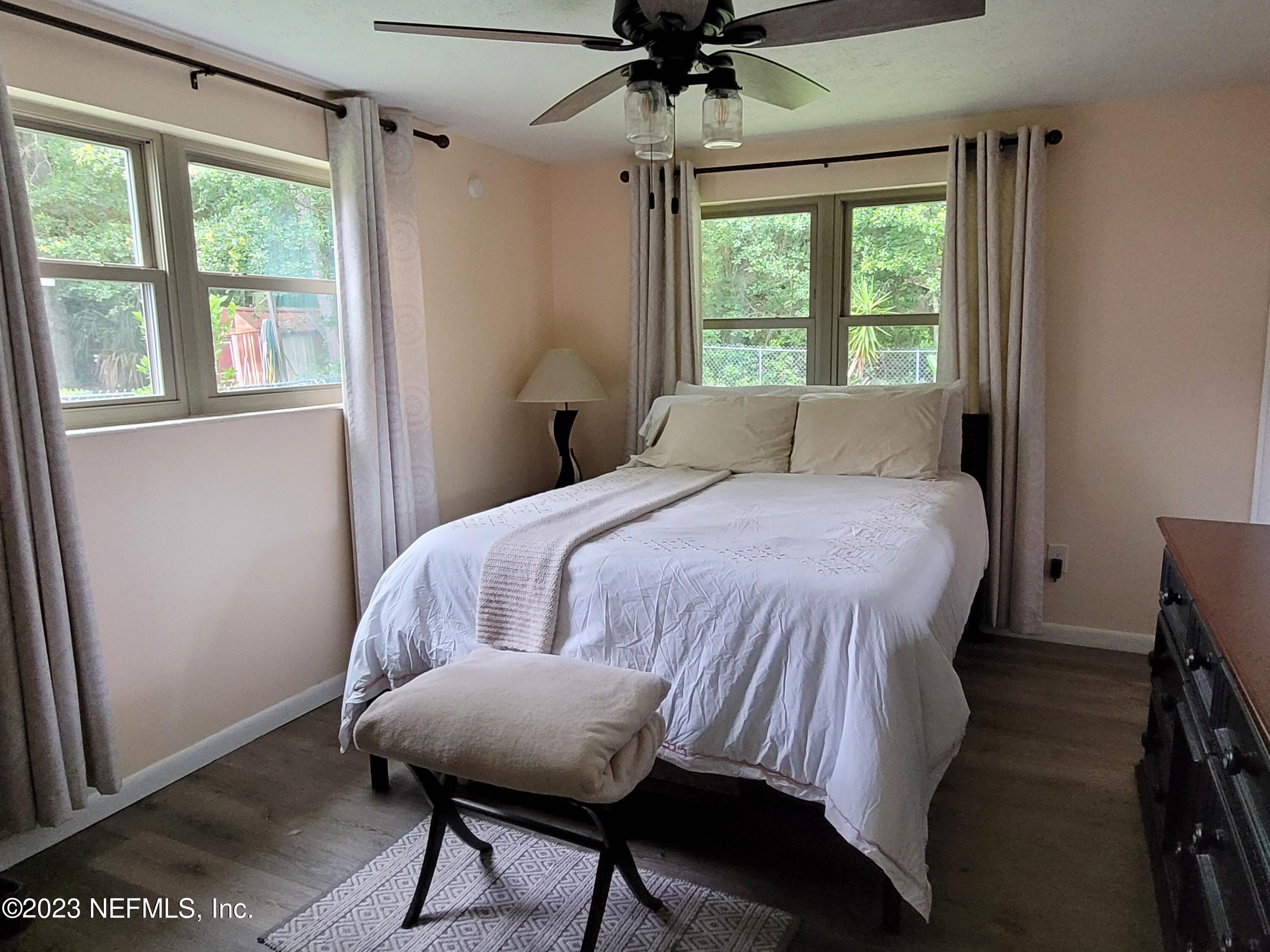 1050 Perkins Place Jacksonville, FL 32221 - Photo 10 of 18 a bedroom with a bed and a window