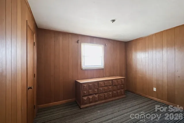 a area with wooden floor and window