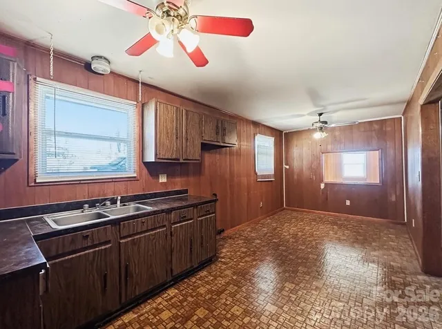 a kitchen with stainless steel appliances granite countertop a stove and a refrigerator