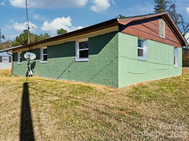 a backyard of a house with lots of green space