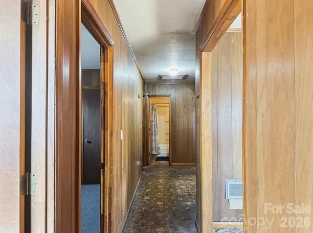 a view of a bathroom from a hallway