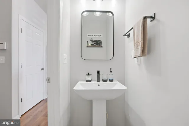 a bathroom with a sink and mirror