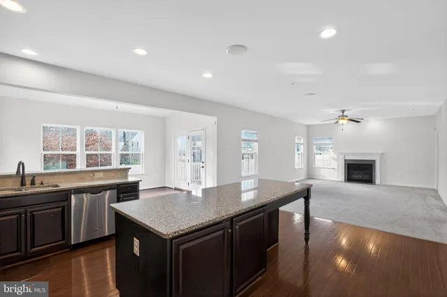 a kitchen with a stove a sink and a refrigerator