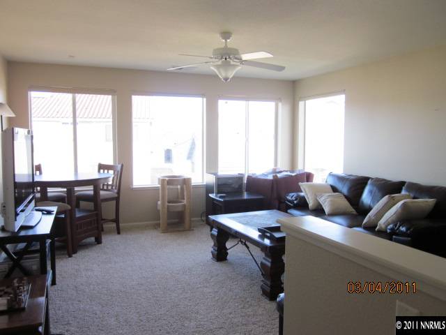 10759 Misty Meadows Drive Reno, NV 89521 - Photo 8 of 11 a living room with furniture and a large window