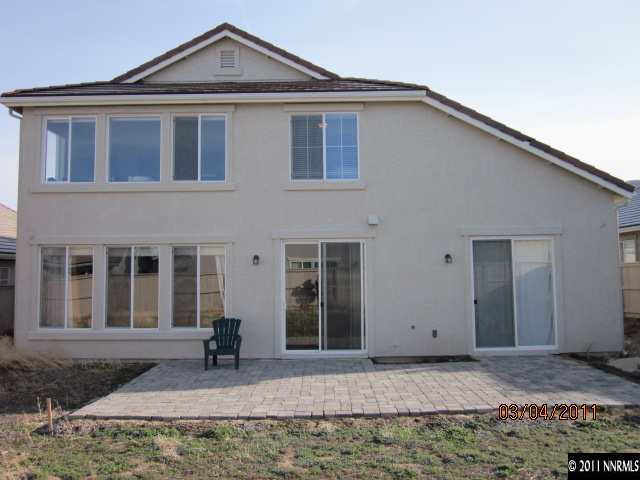 10759 Misty Meadows Drive Reno, NV 89521 - Photo 9 of 11 a front view of a house with a yard
