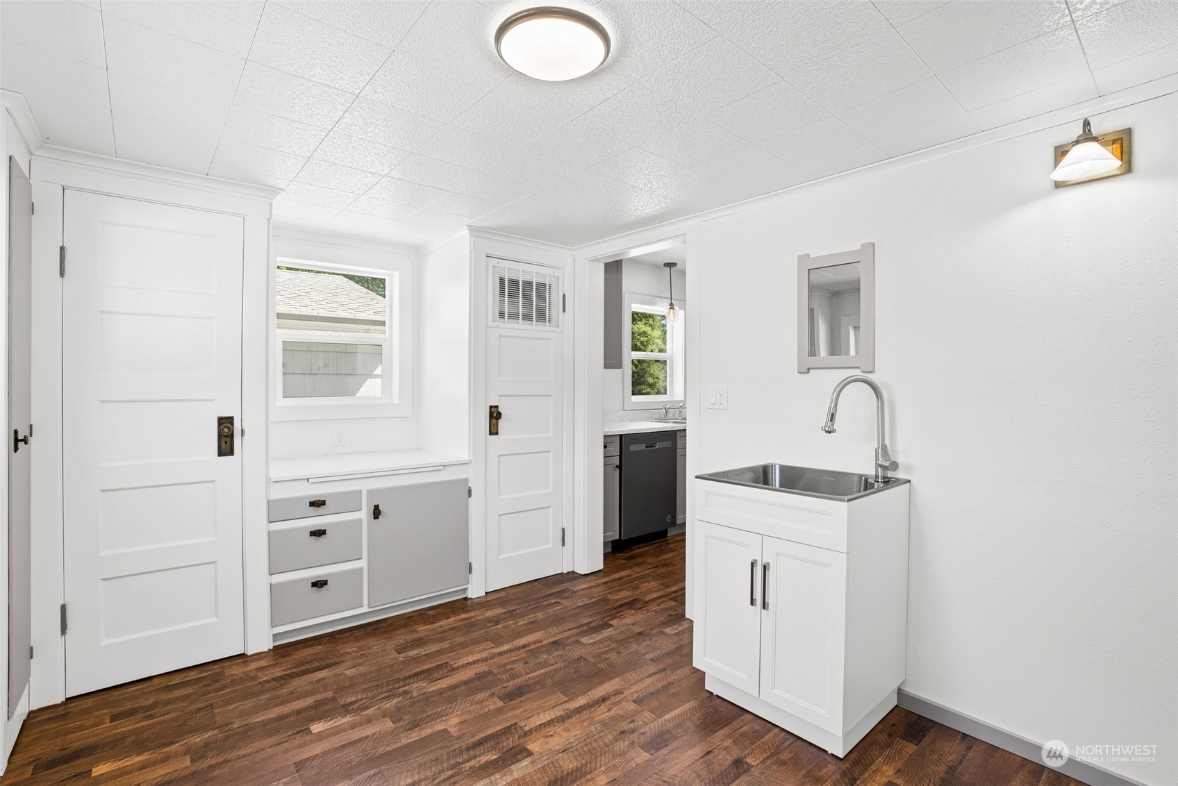 204 Monroe Road Winlock, WA 98596 - Photo 16 of 38 a kitchen with white cabinets and sink