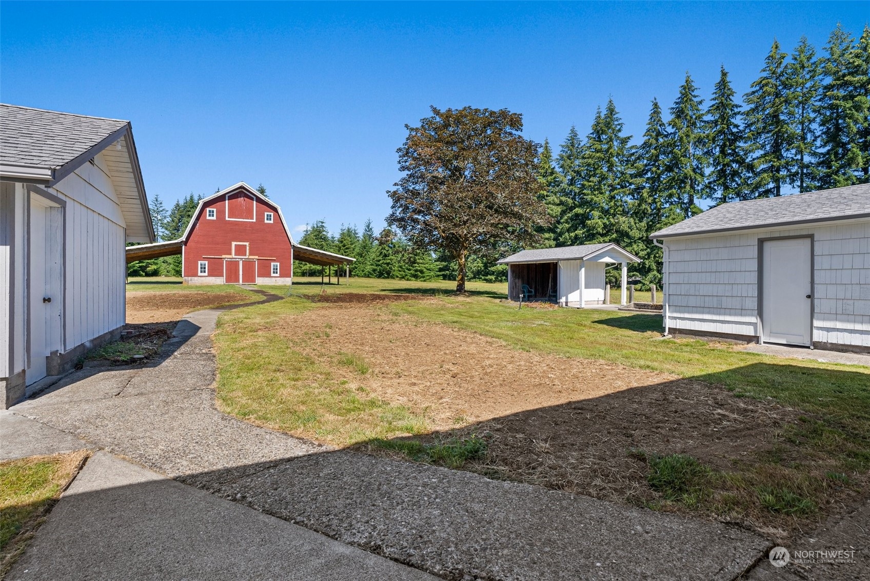 204 Monroe Road Winlock, WA 98596 - Photo 29 of 38 a view of backyard of house with outdoor seating