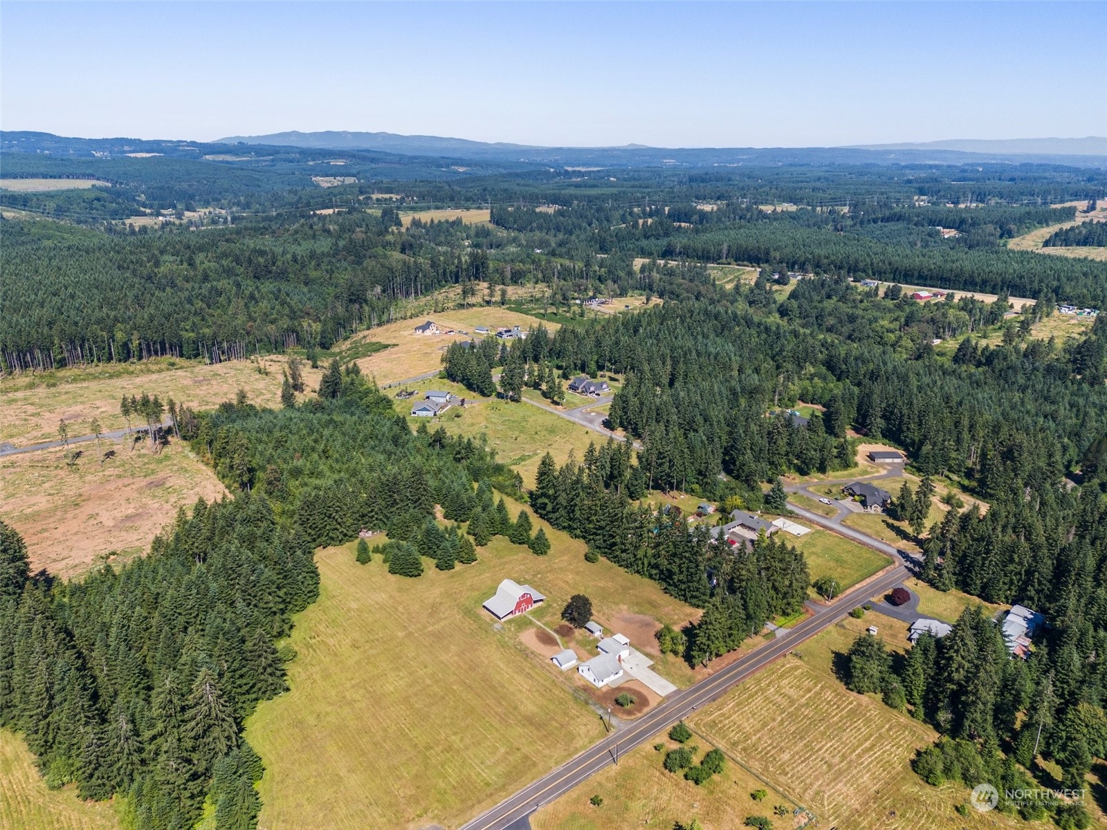 204 Monroe Road Winlock, WA 98596 - Photo 36 of 38 an aerial view of residential houses with outdoor space and river