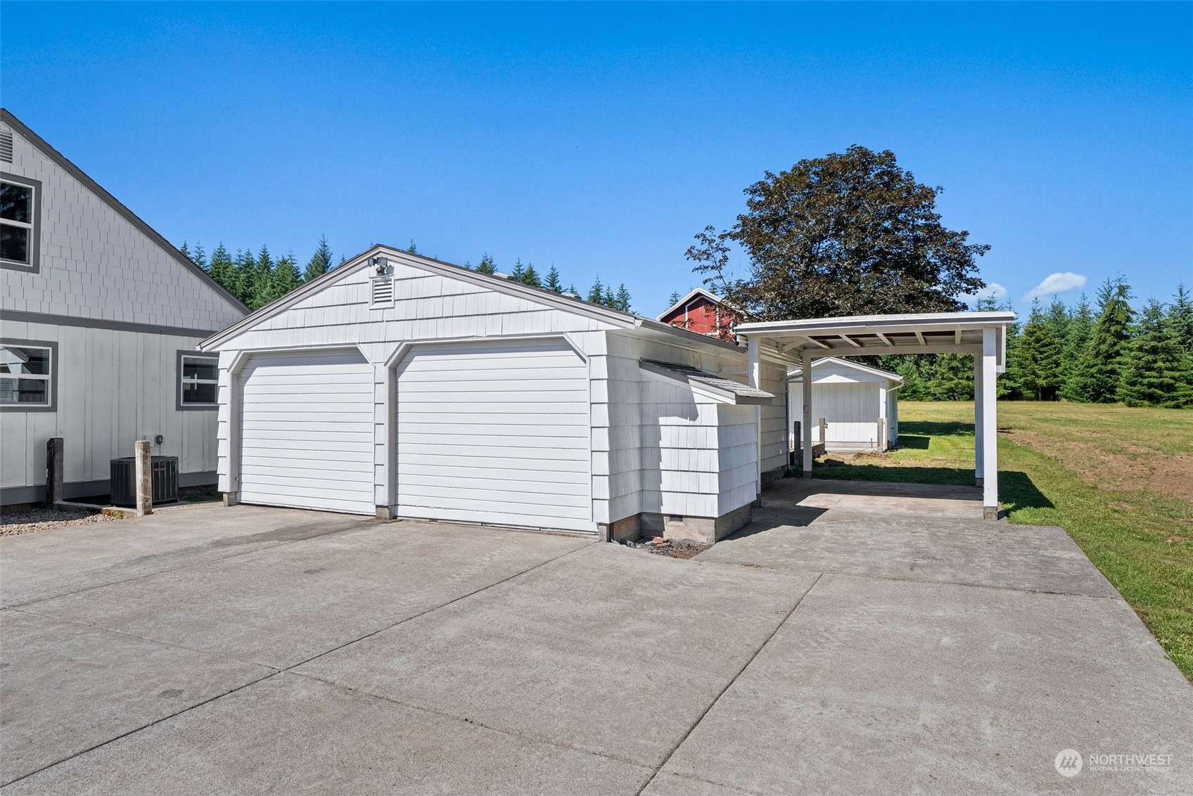 204 Monroe Road Winlock, WA 98596 - Photo 7 of 38 a view of a house with a yard and garage