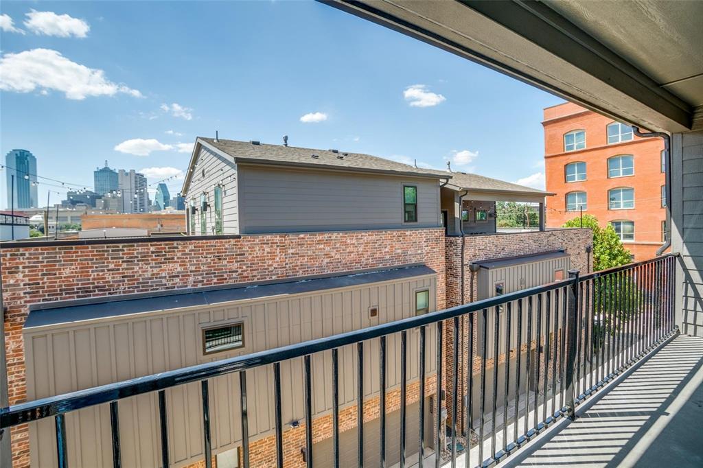1552 Cosette Drive Dallas, TX 75215 - Photo 19 of 23 Balcony with a skyline view