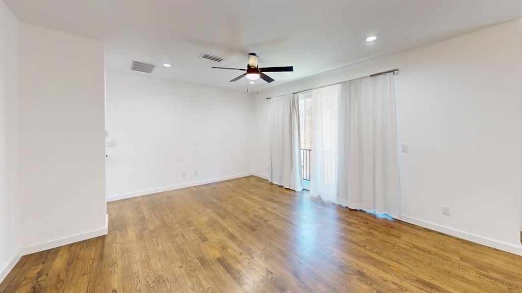1552 Cosette Drive Dallas, TX 75215 - Photo 7 of 23 Empty room with light wood-style flooring, ceiling fan, and recessed lighting