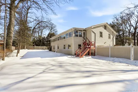 a view of a house with snow on the background