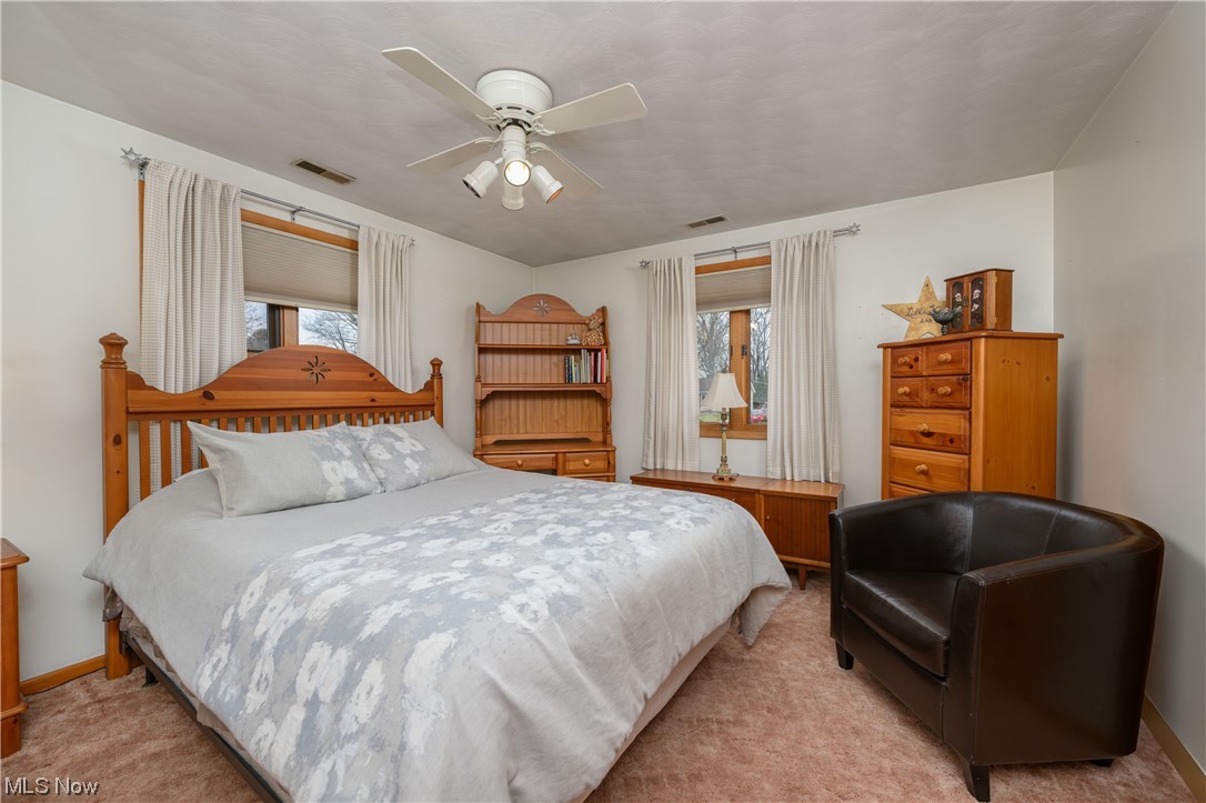 5304 Sibila Road Northwest Canton, OH 44718 - Photo 27 of 29 Bedroom with ceiling fan and light carpet