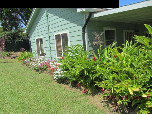 779 Mopua Street Haiku, HI 96708 - Photo 8 of 16 a front view of a house with a yard
