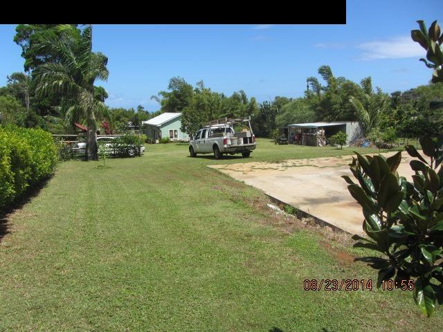 779 Mopua Street Haiku, HI 96708 - Photo 10 of 16 a car parked in front of a house with a yard