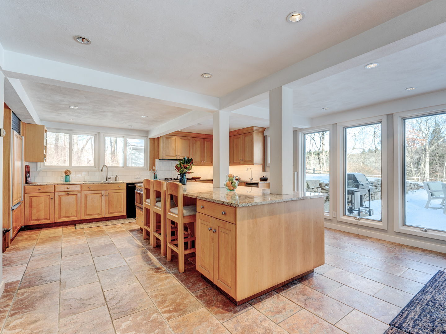 415 South Street Litchfield, CT 06759 - Photo 16 of 40 a large white kitchen with a large window and white stainless steel appliances
