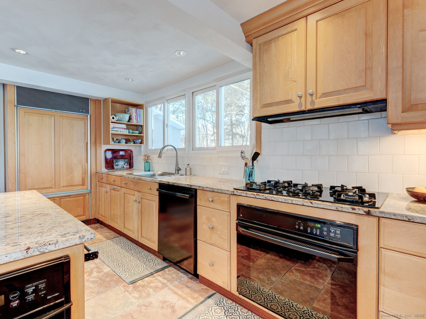 415 South Street Litchfield, CT 06759 - Photo 18 of 40 a kitchen with stainless steel appliances granite countertop a stove and a microwave