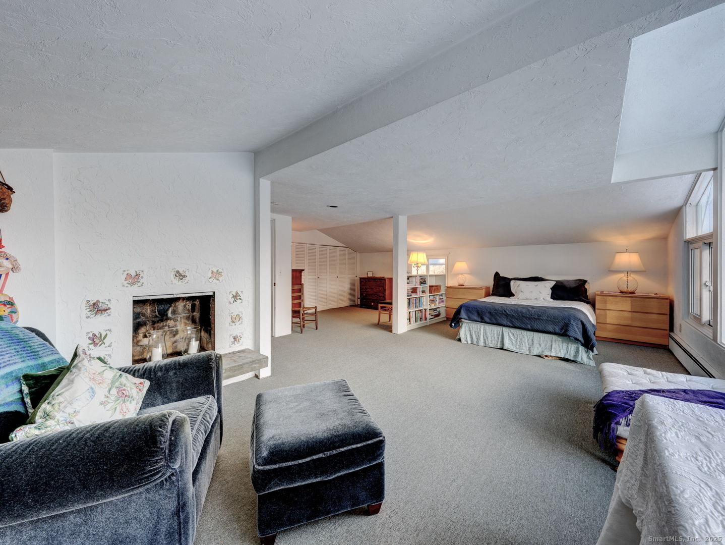 415 South Street Litchfield, CT 06759 - Photo 27 of 40 a living room with furniture and a fireplace