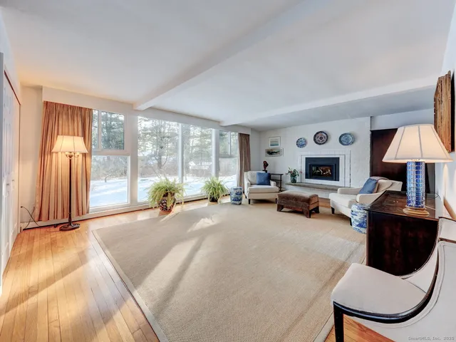 a bed room with furniture and a window