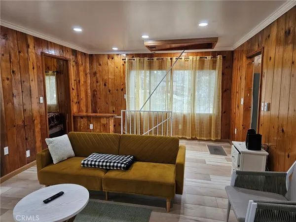 a balcony with furniture and a large window