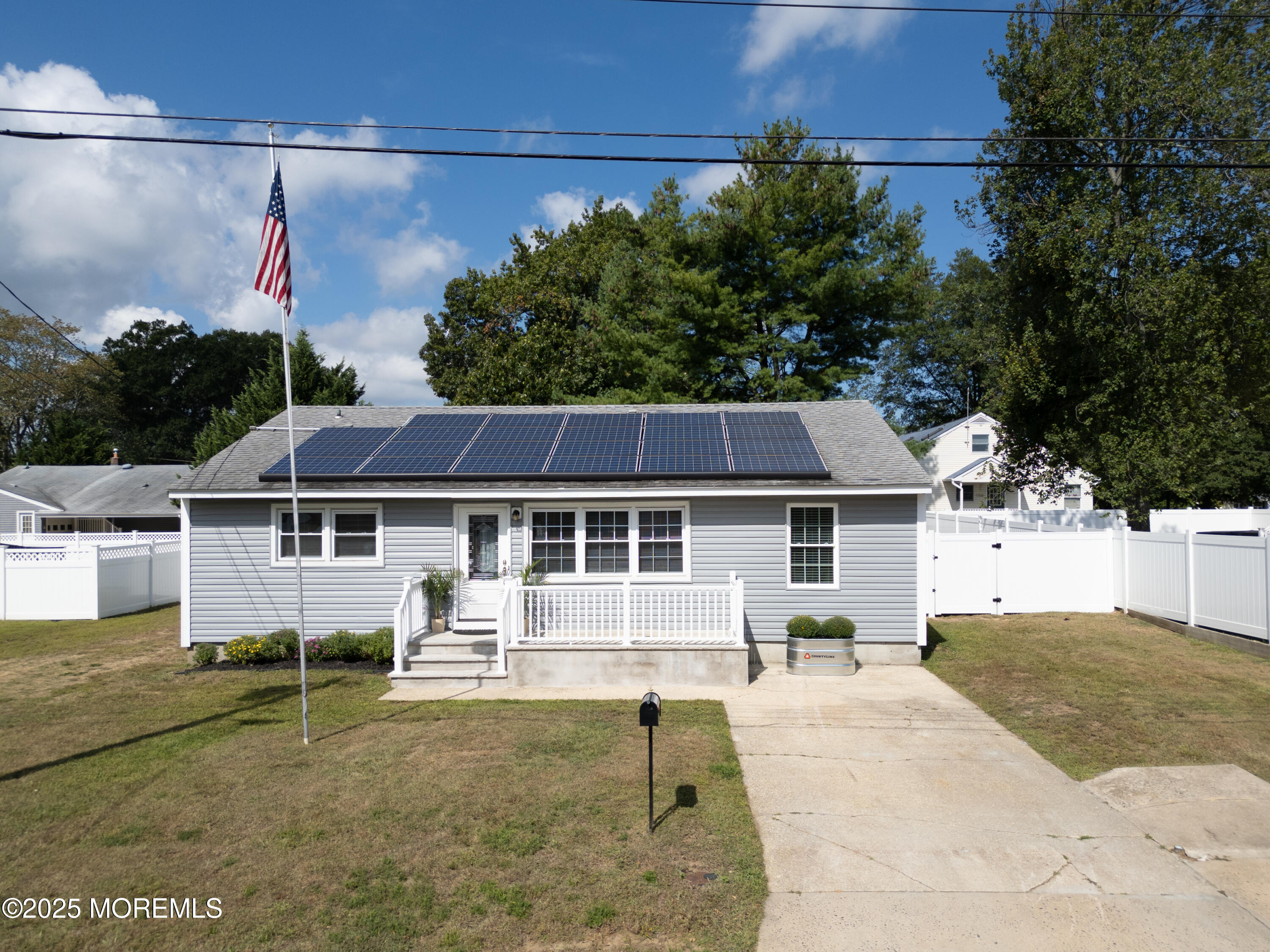 422 Maple Drive Belford, NJ 07718 - Photo 1 of 55 a view of a house with a backyard and a tree