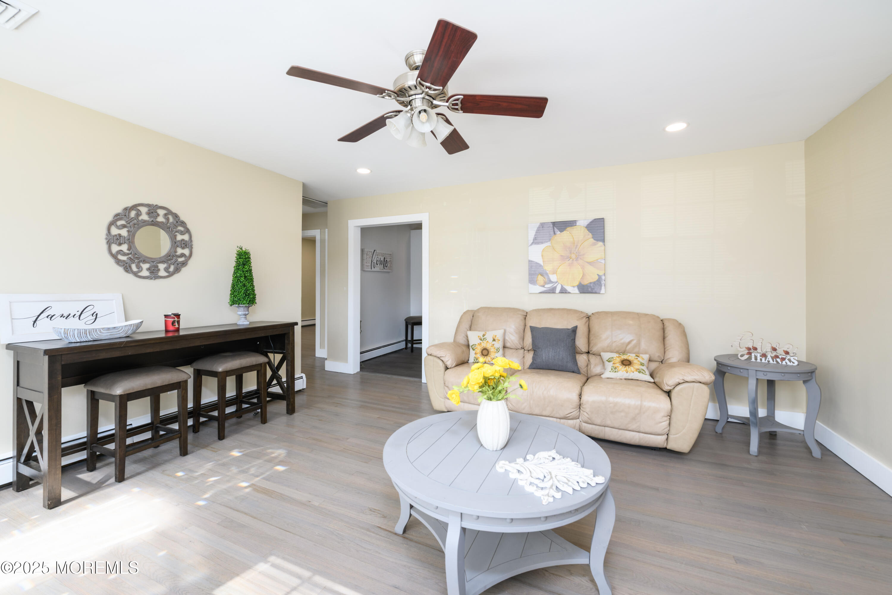 422 Maple Drive Belford, NJ 07718 - Photo 15 of 55 a living room with furniture and a wooden floor