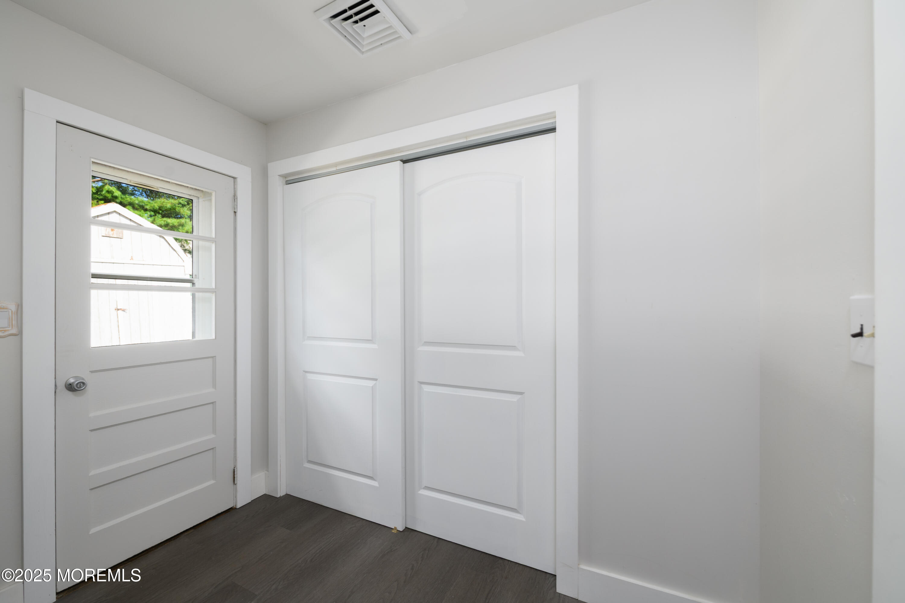 422 Maple Drive Belford, NJ 07718 - Photo 25 of 55 a view of an empty room with closet and a window