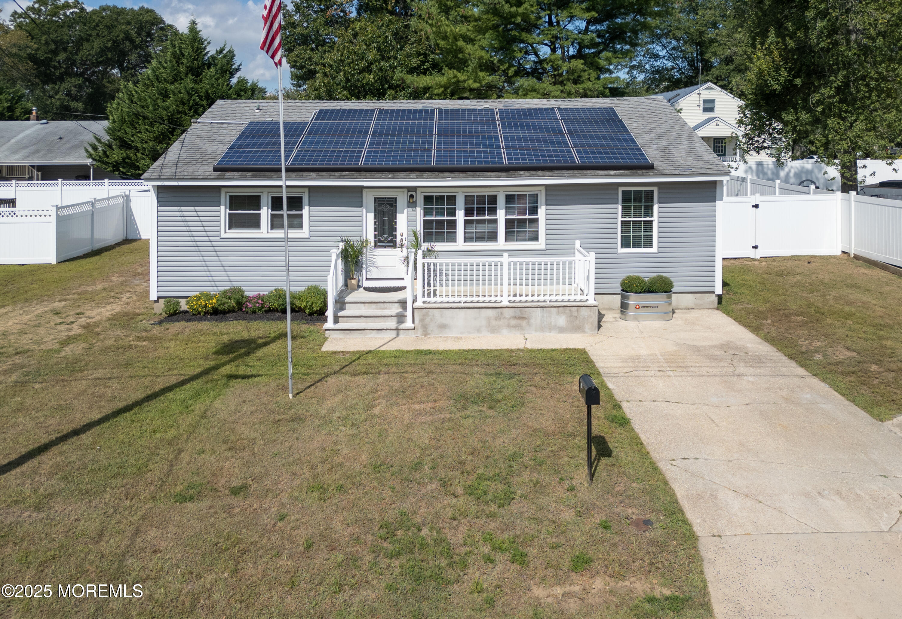 422 Maple Drive Belford, NJ 07718 - Photo 46 of 55 a view of a house with a yard and sitting area