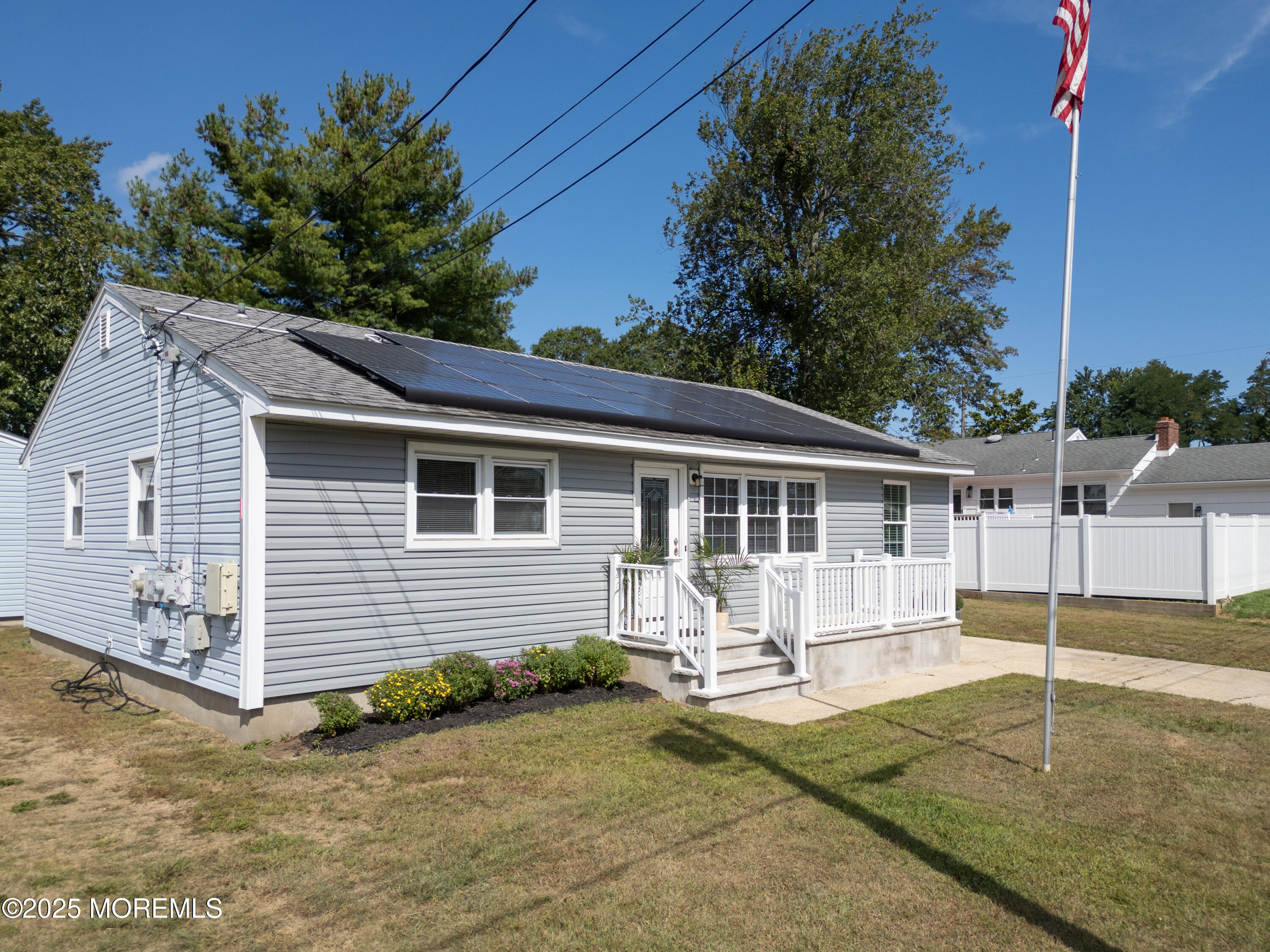422 Maple Drive Belford, NJ 07718 - Photo 54 of 55 a front view of a house with a yard