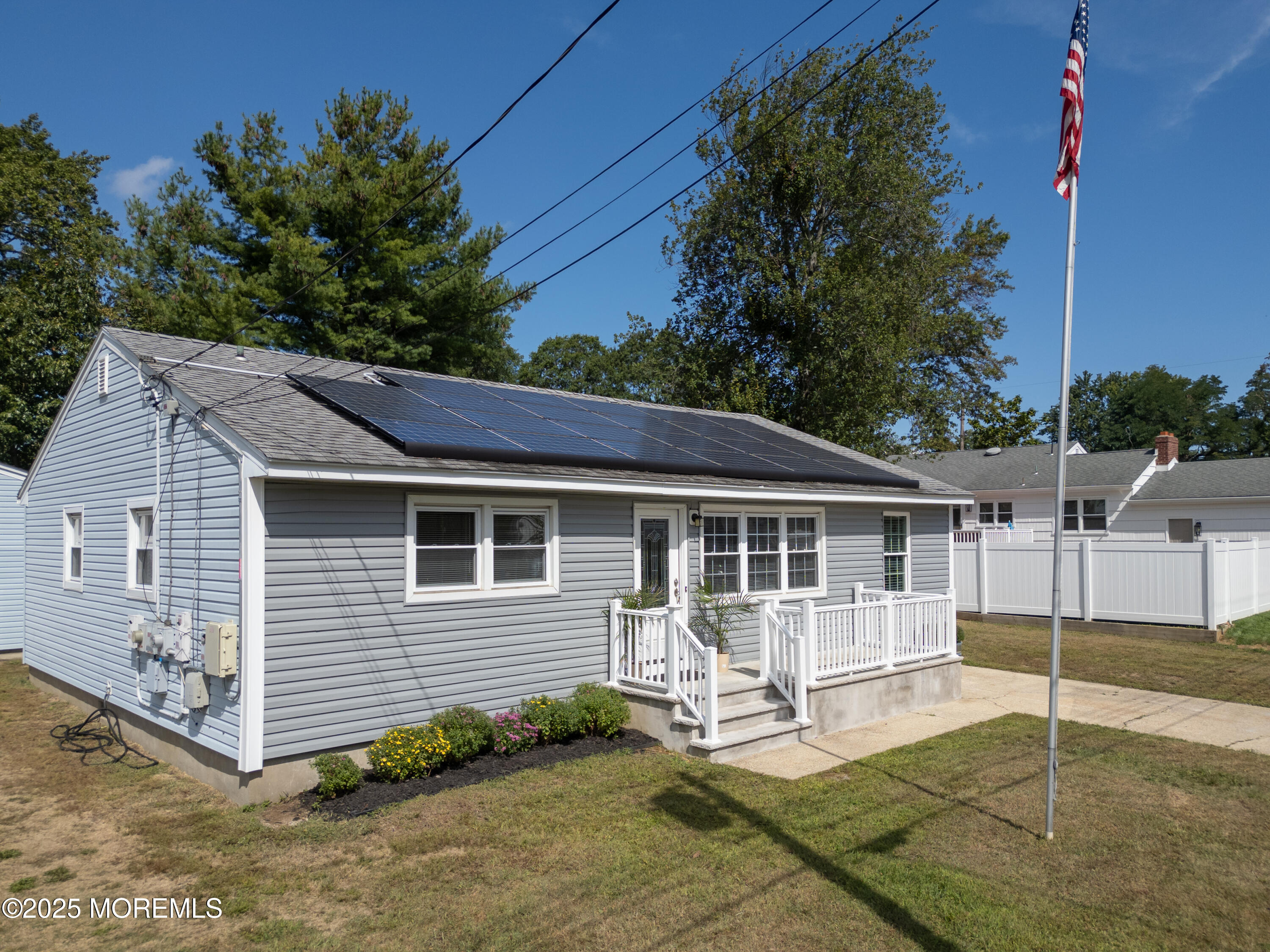 422 Maple Drive Belford, NJ 07718 - Photo 55 of 55 a white house covered with tall trees