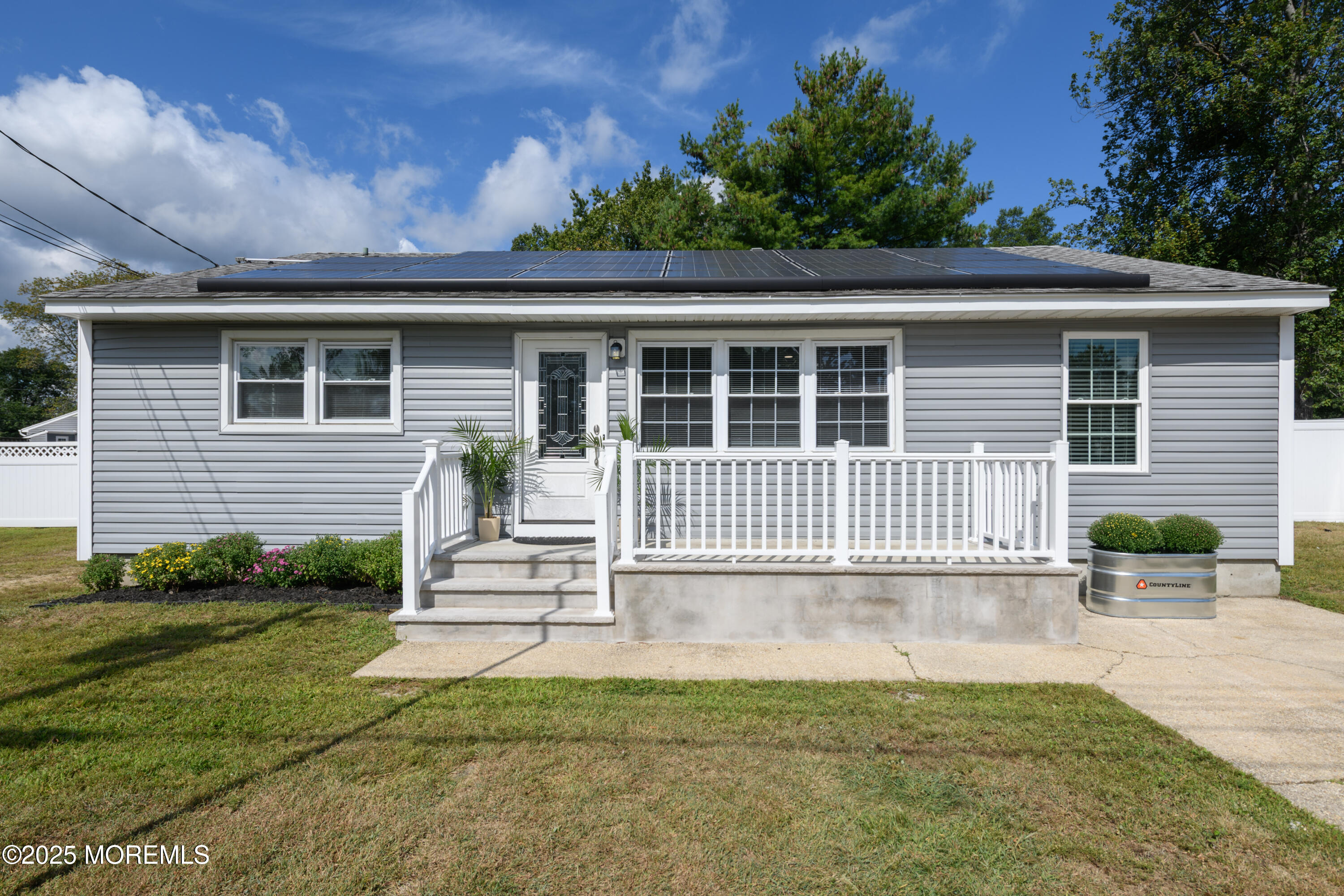 422 Maple Drive Belford, NJ 07718 - Photo 8 of 55 a front view of a house with a garden