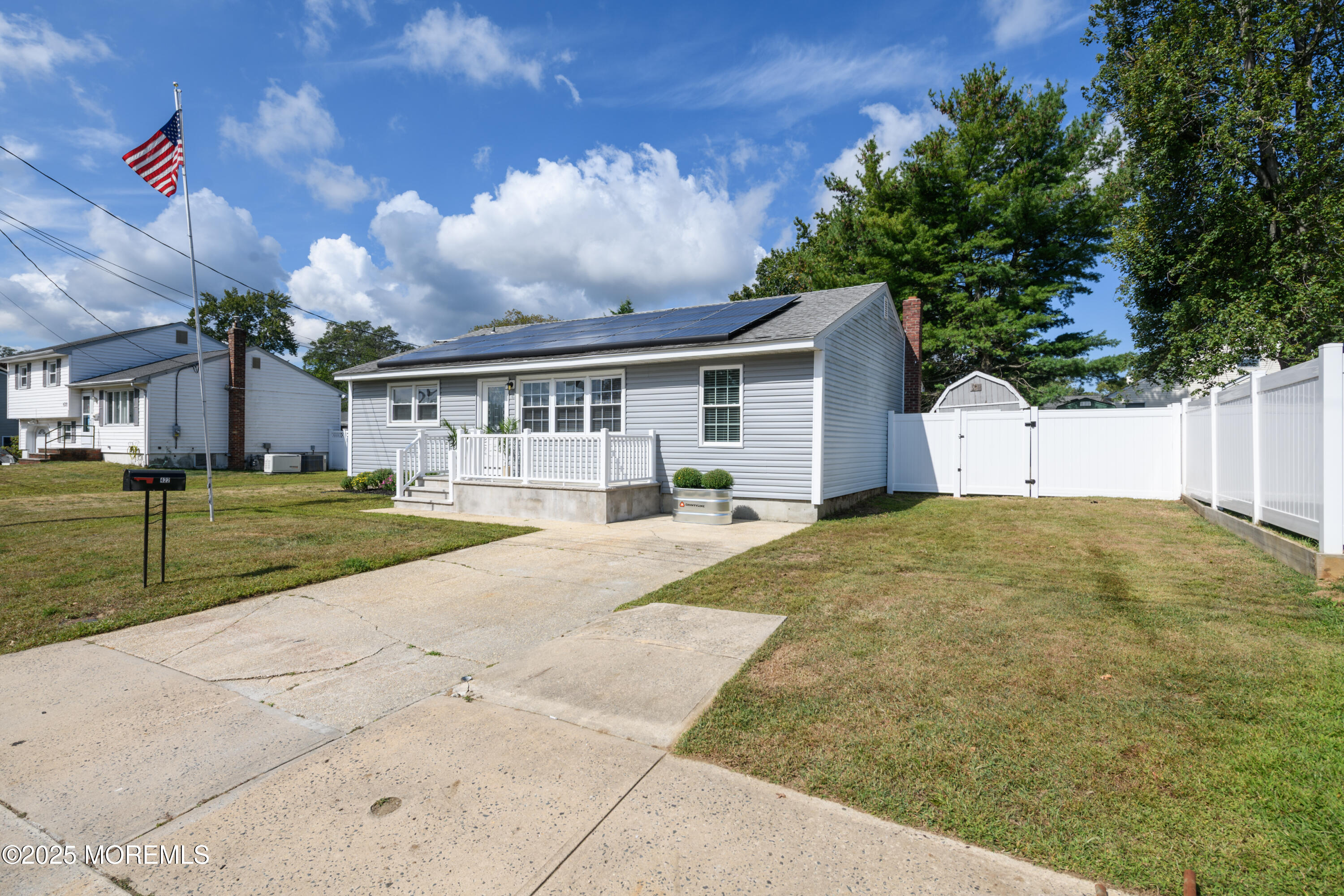 422 Maple Drive Belford, NJ 07718 - Photo 9 of 55 a view of large house with a big yard
