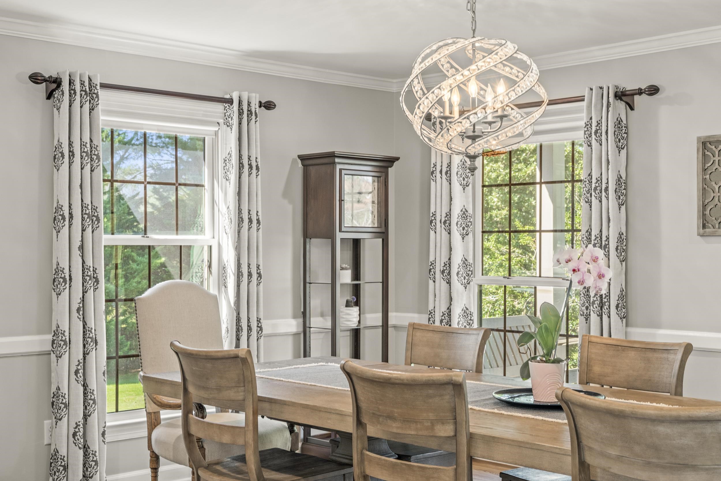 1109 Ross Road Lexington, VA 24450 - Photo 15 of 71 a dining room with furniture a chandelier and wooden floor