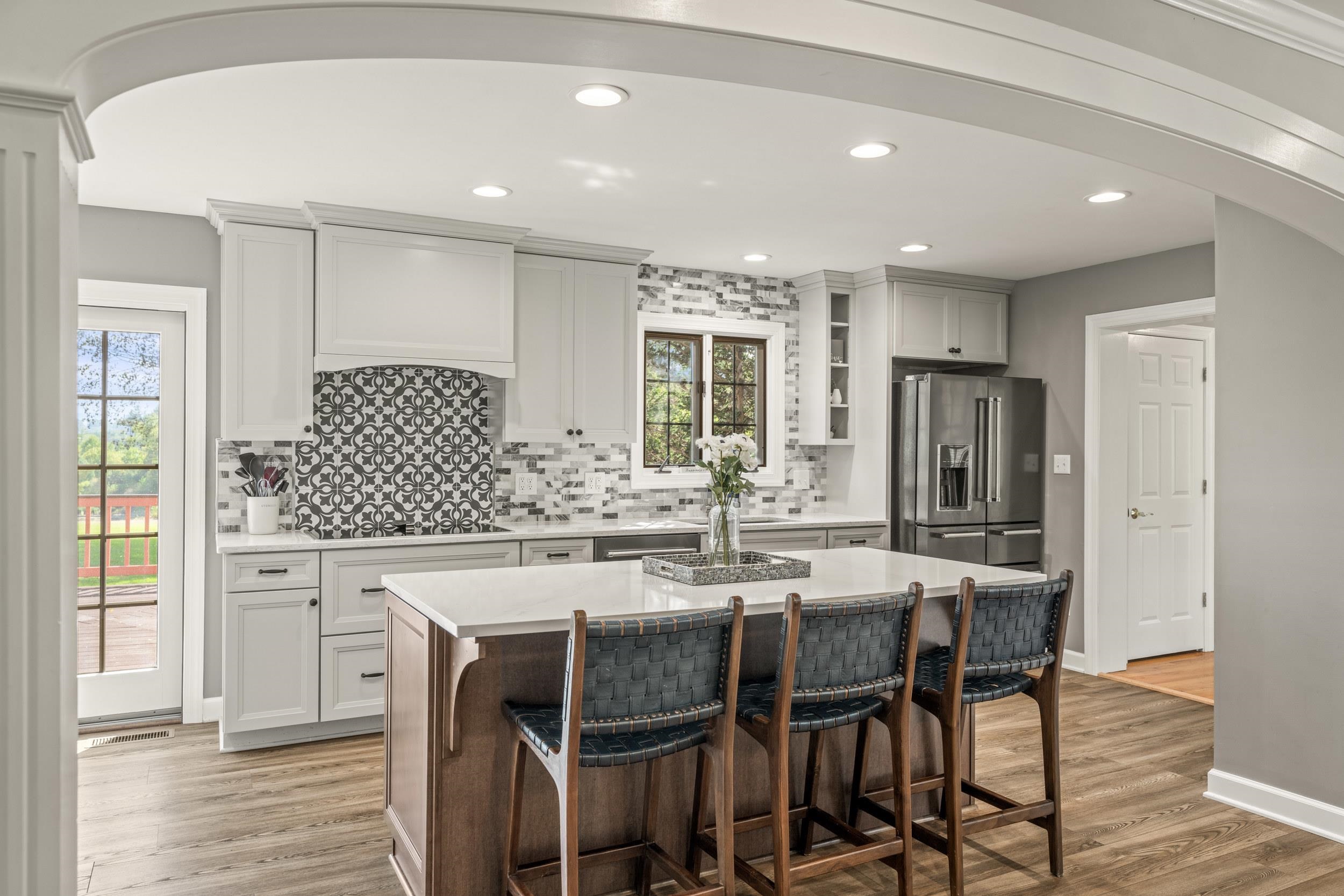 1109 Ross Road Lexington, VA 24450 - Photo 16 of 71 a kitchen with stainless steel appliances kitchen island granite countertop a dining table chairs and a refrigerator