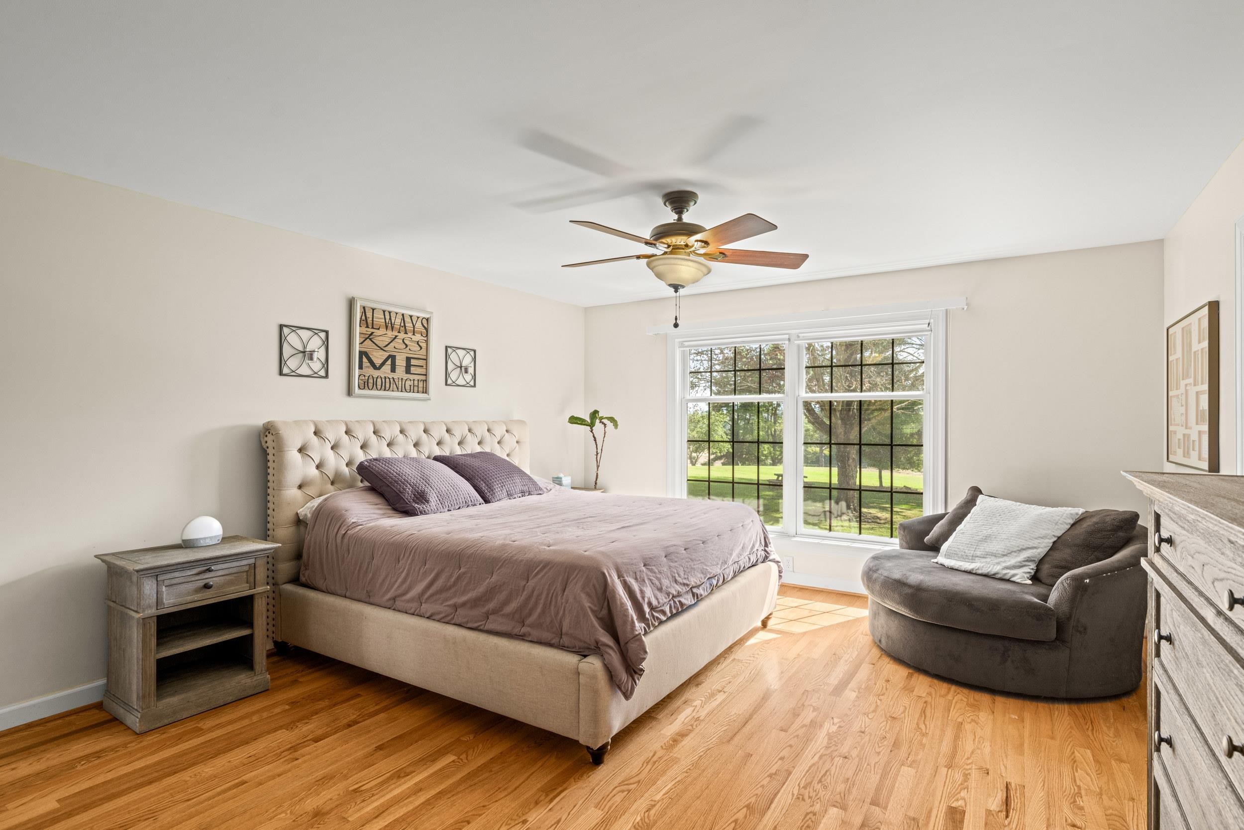 1109 Ross Road Lexington, VA 24450 - Photo 26 of 71 a spacious bedroom with a bed and a couch