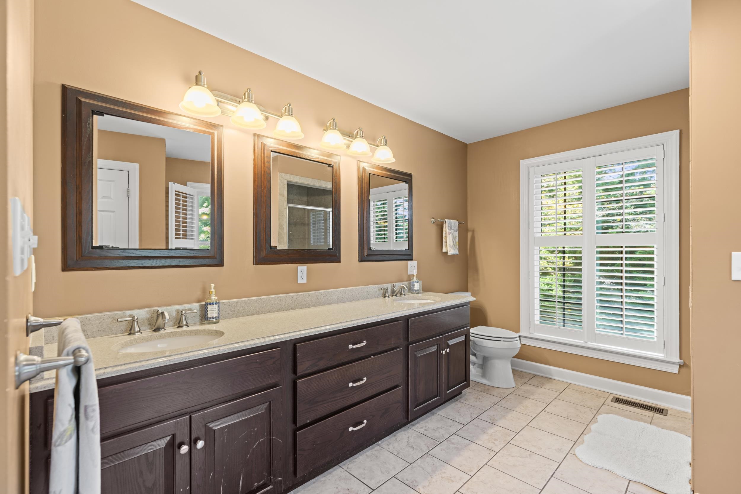 1109 Ross Road Lexington, VA 24450 - Photo 29 of 71 a spacious bathroom with a granite countertop sink mirror and a