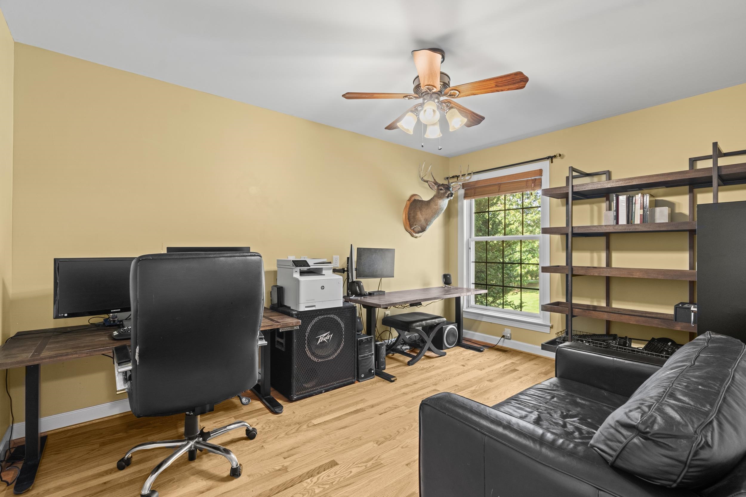 1109 Ross Road Lexington, VA 24450 - Photo 30 of 71 a living room with furniture and a flat screen tv