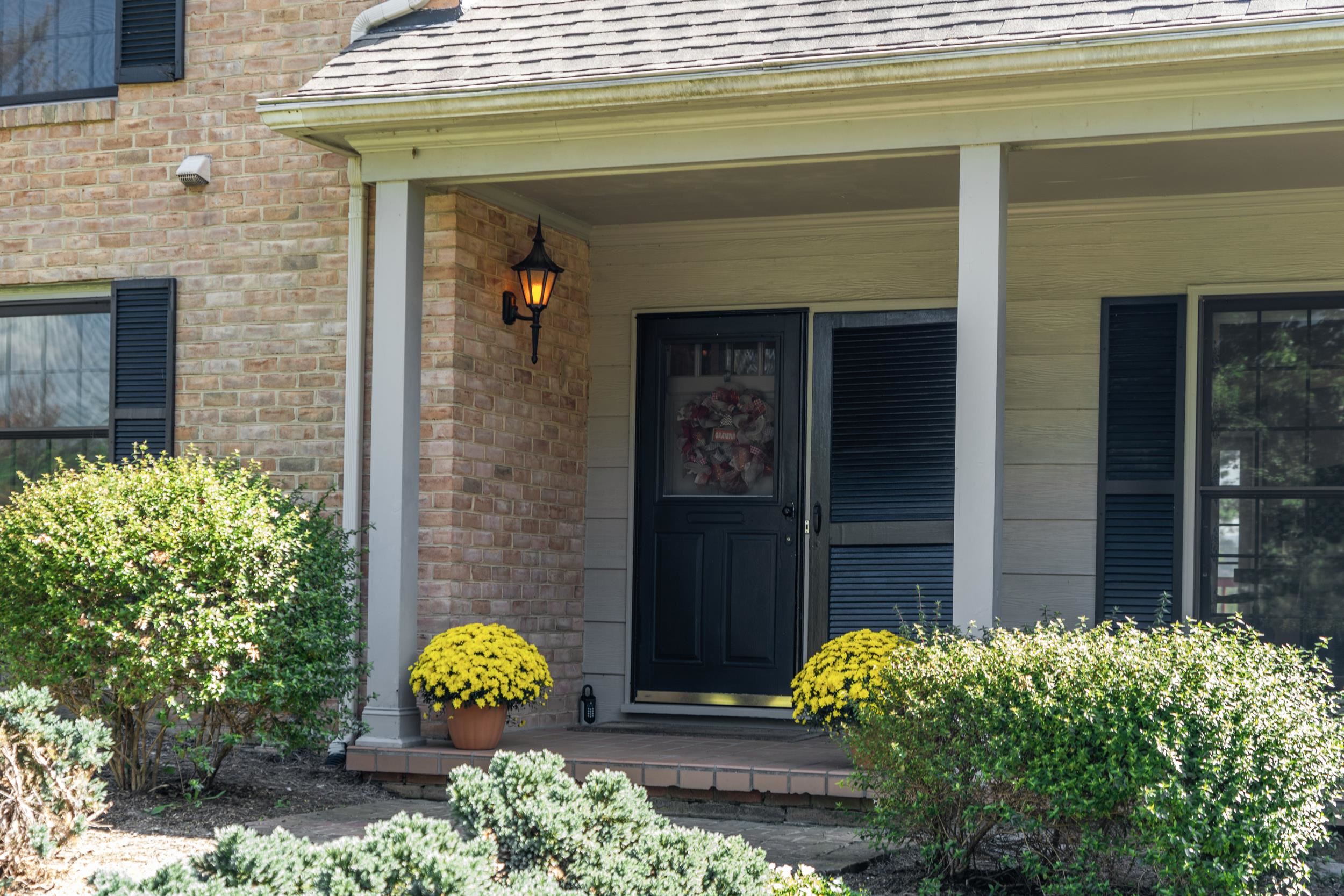 1109 Ross Road Lexington, VA 24450 - Photo 3 of 71 a front view of a house with outdoor seating and flowers