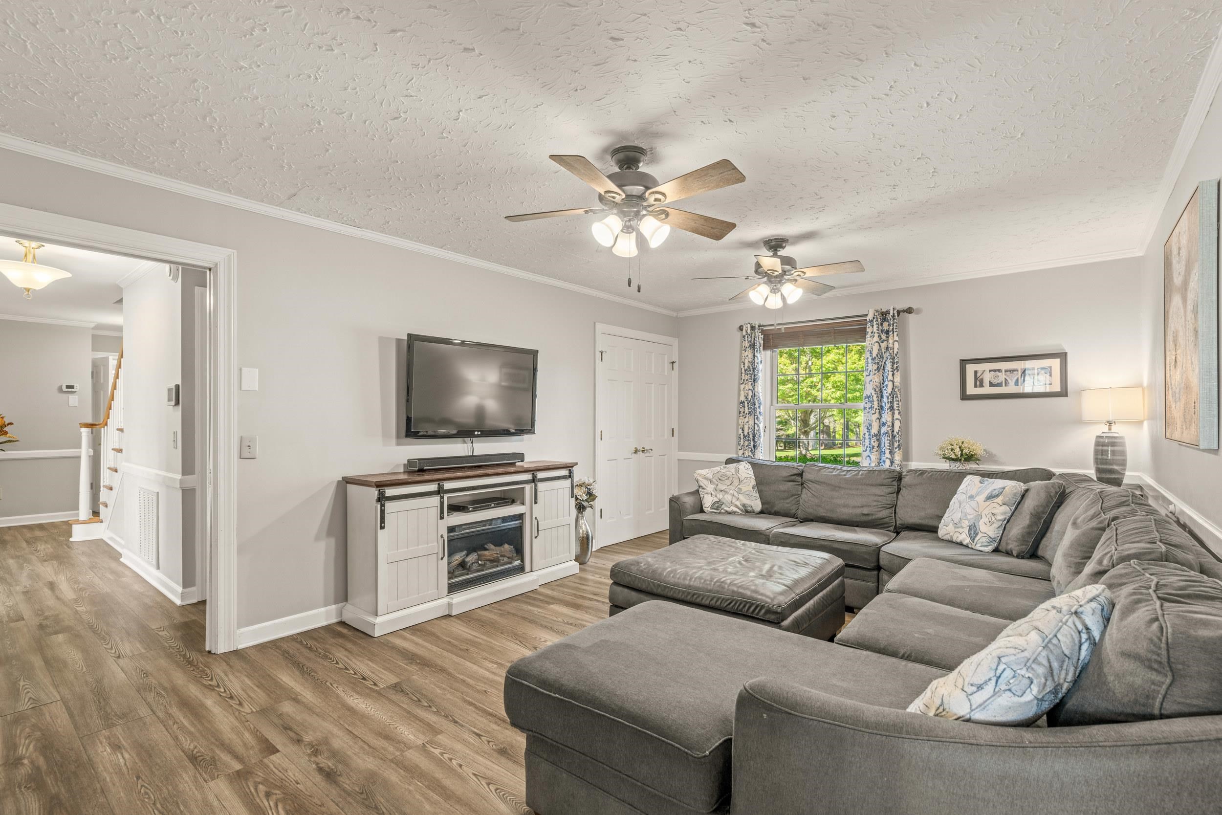 1109 Ross Road Lexington, VA 24450 - Photo 31 of 71 a living room with furniture and a flat screen tv